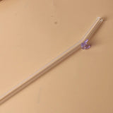 Glazen rietje met vlinder